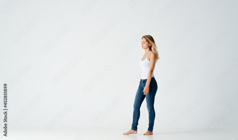 woman in jeans barefoot Positive light motion background woman in jeans barefoot Positive light motion background