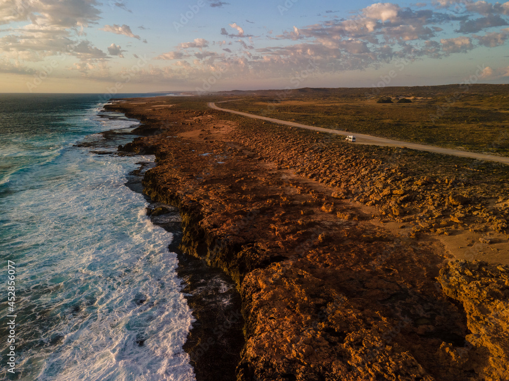 Fototapeta premium Golden hour sunset over Quobba blowholes, Western Australia 