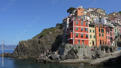 Picturesque colorful houses in Riomaggiore, Italy. Riomaggiore is one of the Cinque Terre towns and a popular tourist destination in Europe. photo