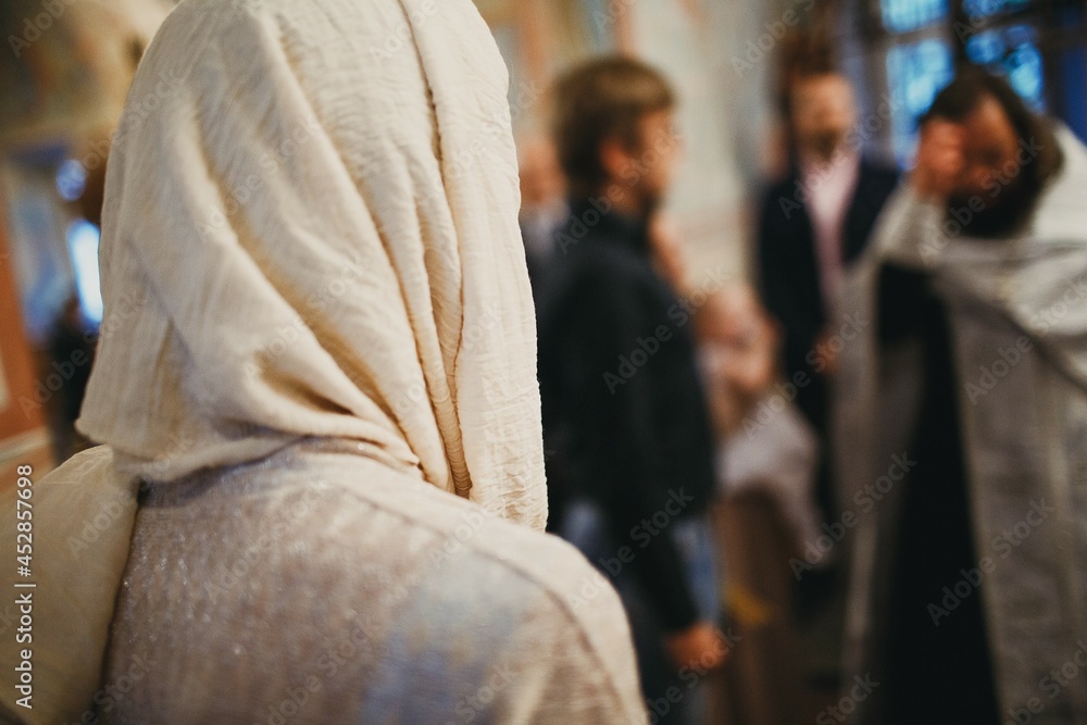 Orthodox Christian priest and parishioner praying in the church Orthodox Christian priest and parishioner praying in the church