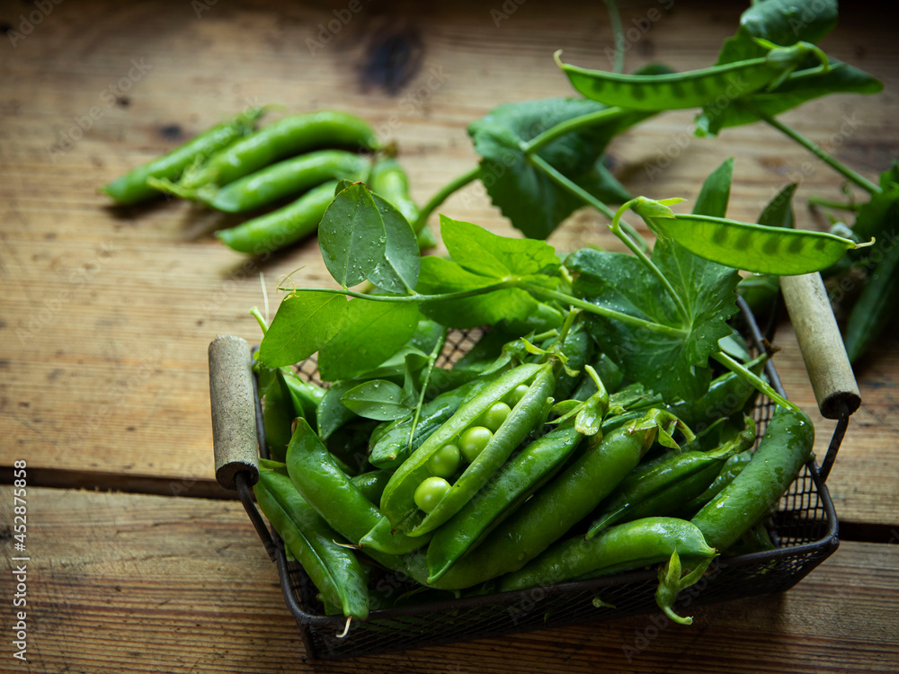 Fresh green peas pods and green peas with sprouts. Healthy eating, fresh vegetables. Fresh green peas pods and green peas with sprouts. Healthy eating, fresh vegetables.