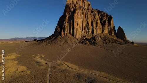 Cinematic aerial shot of iconic monolith in Shiprock in New Mexico photo