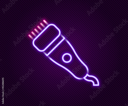 Glowing neon line Electrical hair clipper or shaver icon isolated on black background. Barbershop symbol. Colorful outline concept. Vector