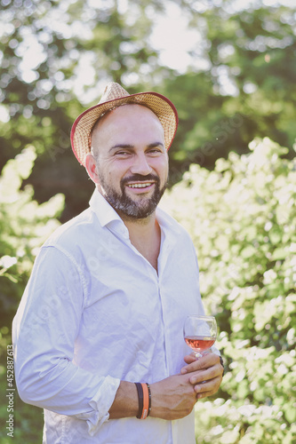 Young Happy Winegrowers man smiling at camera in the grape fields at sunset Smiling Happy italian vintner 