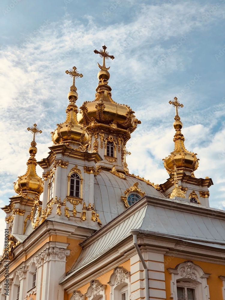 a church with gold domes, an ancient cathedral