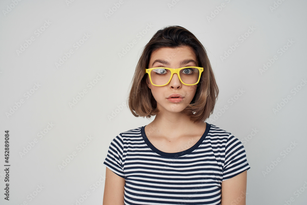 cheerful woman in yellow glasses summer fashion posing studio