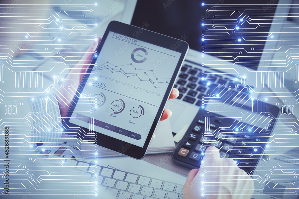 Double exposure of man's hands holding and using a digital device and tech theme hologram drawing. Technology concept. Double exposure of man's hands holding and using a digital device and tech theme hologram drawing. Technology concept.