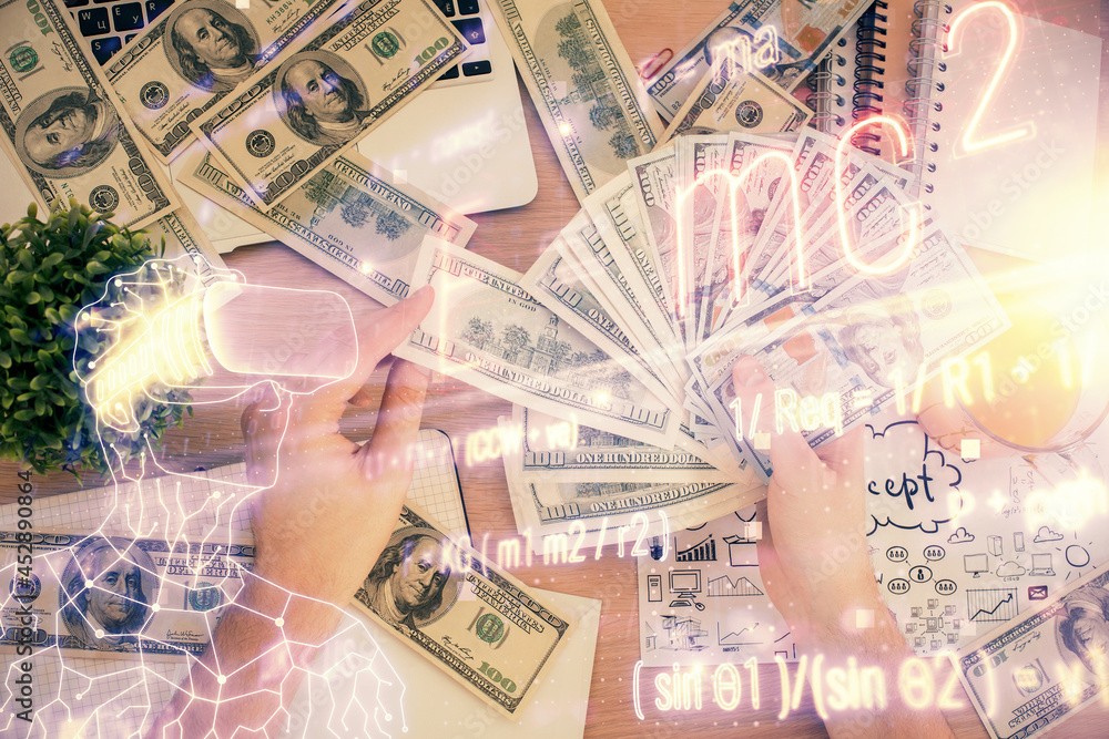 Multi exposure of Formulas drawing hologram and USA dollars bills and man hands. Education Multi exposure of Formulas drawing hologram and USA dollars bills and man hands. Education