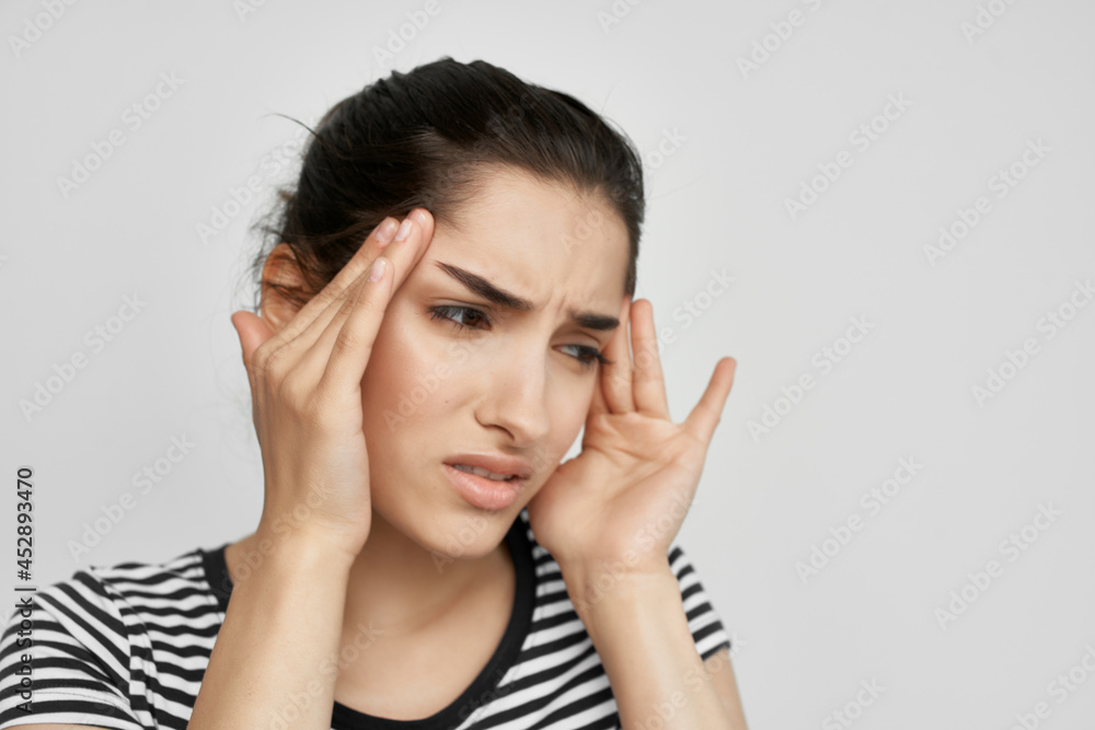 woman holding her head migraine pain depression dissatisfaction woman holding her head migraine pain depression dissatisfaction