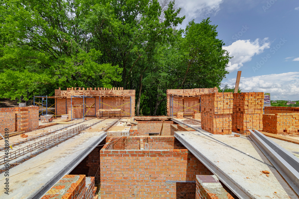 Construction process of new residential building at construction site. High quality photo Construction process of new residential building at construction site. High quality photo
