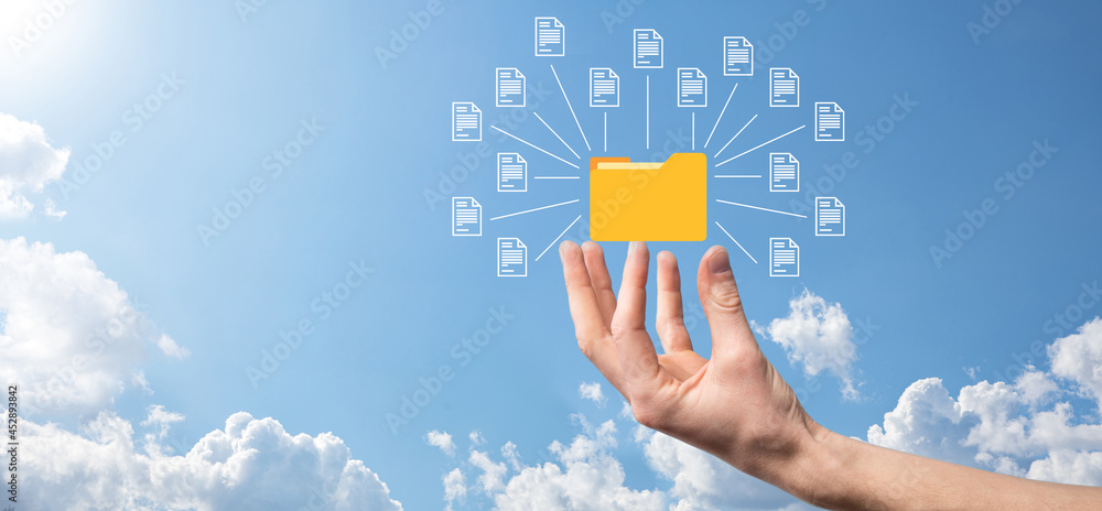 Document Management System DMS .Businessman hold folder and document icon.Software for archiving, searching and managing corporate files and information.Internet Technology Concept.Digital security. Document Management System DMS .Businessman hold folder and document icon.Software for archiving, searching and managing corporate files and information.Internet Technology Concept.Digital security.