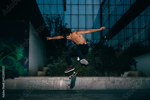 skateboarder stunt trick outdoors