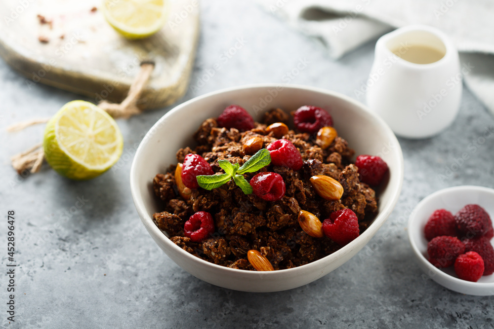 Homemade chocolate granola with raspberry Homemade chocolate granola with raspberry
