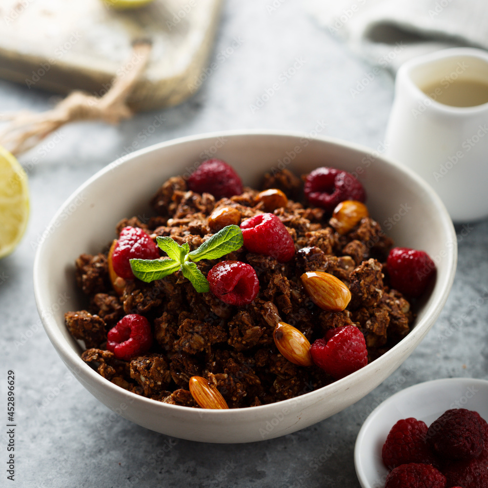 Homemade chocolate granola with raspberry Homemade chocolate granola with raspberry