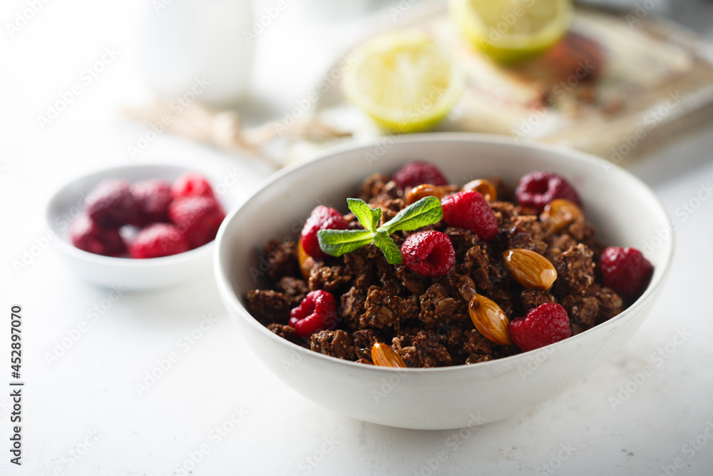 Homemade chocolate granola with raspberry