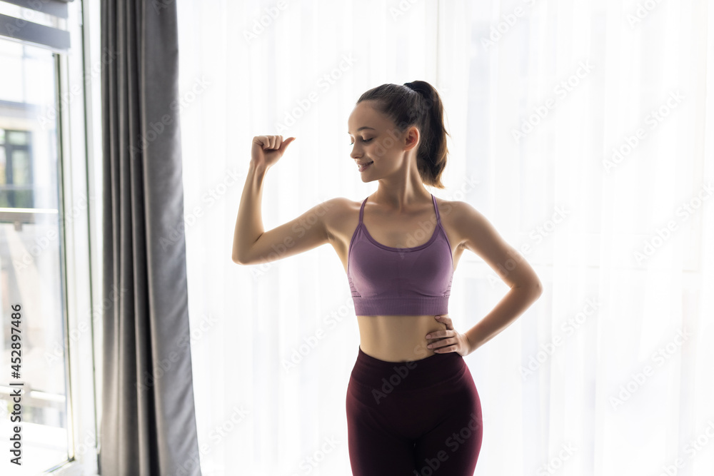 Beautiful woman sport at home . Fitness exercise with kettlebell, smart training, exercise, home workout Beautiful woman sport at home . Fitness exercise with kettlebell, smart training, exercise, home workout