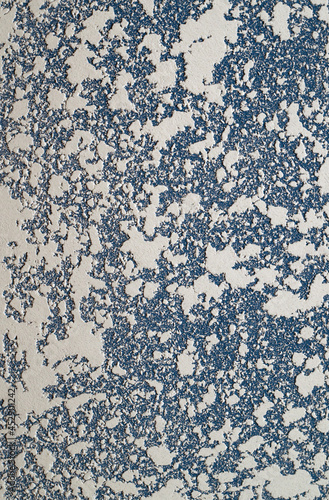 White and blue Textured putty on the wall..