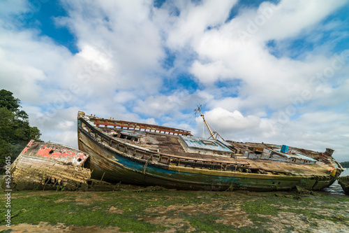 Old abandoned shipwrecks on the river bank