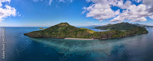 Drone view of white sand beach of Mayotte turquoise lagoon