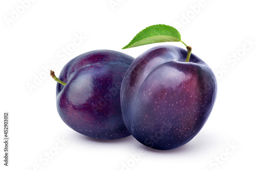Canvas Print Pair of purple Plums with leaf isolated on white background.