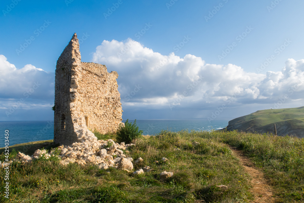 ruined tower of the tagle beach in cantabria