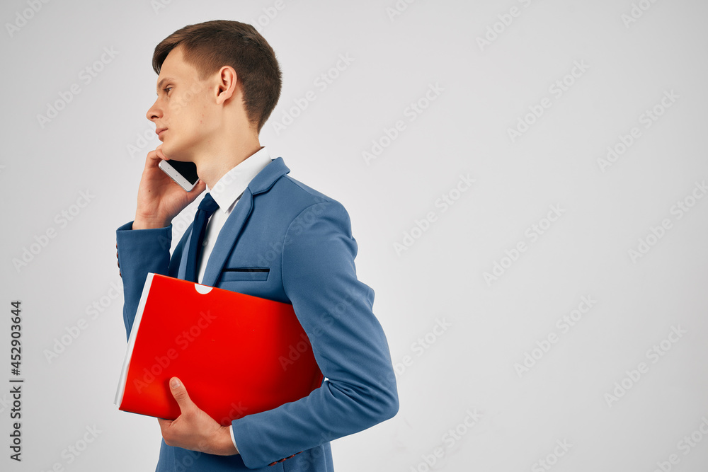 business man with documents talking on the phone office professional business man with documents talking on the phone office professional