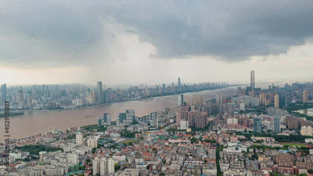 Timelapse of Aerial view of Wuhan skyline and Yangtze river with supertall skyscraper under construction in Wuhan Hubei China.