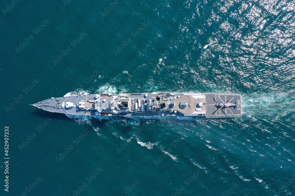 Aerial view of naval ship, battle ship, warship, Military ship resilient and armed with weapon systems, though armament on troop transports. support navy ship. Military sea transport.