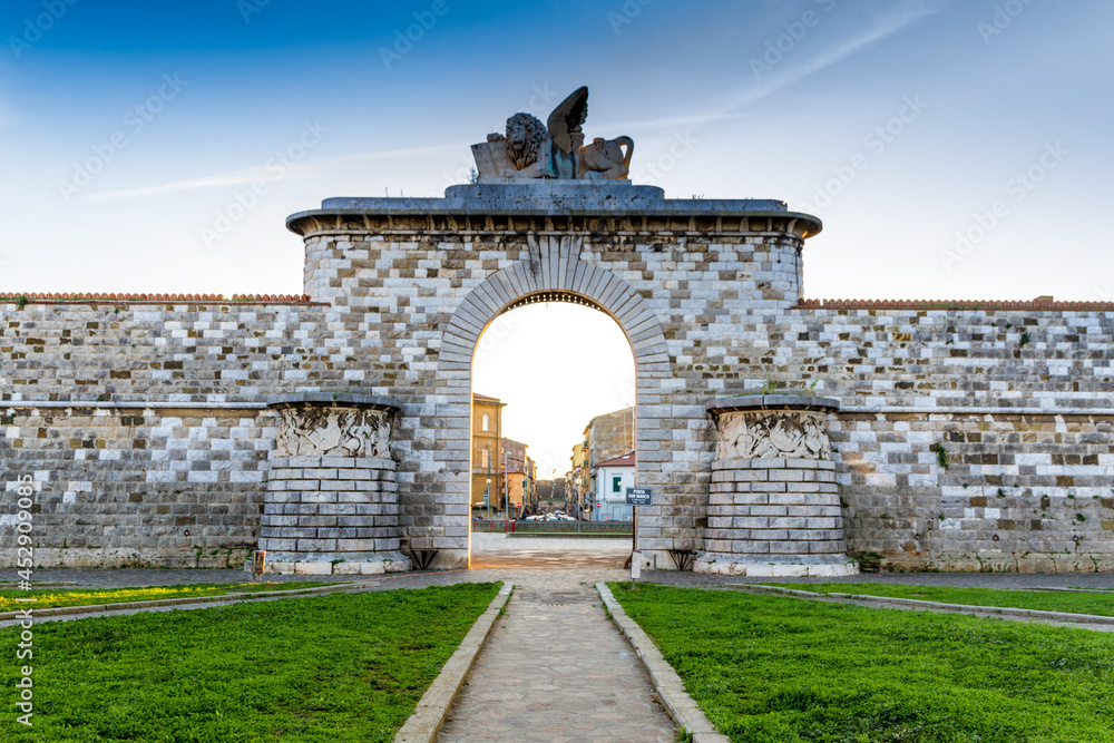 The San Marco gate in Leghorn, Italy at sunset
