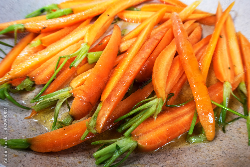 fried carrots in a pan. roasted vegetables fried carrots in a pan. roasted vegetables