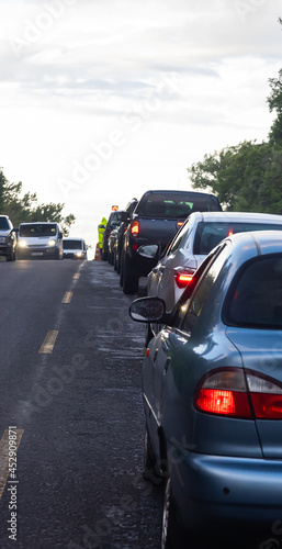 traffic jams on the road are associated with the repair of the roadway. evening