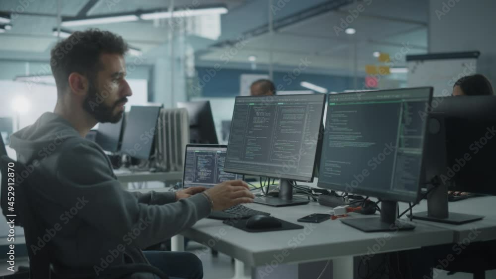 Diverse Office: Enthusiastic White IT Programmer Working on Desktop Computer. Male Specialist Creating Innovative Software. Engineer Developing App, Program, Video Game. Writing Code in Terminal Diverse Office: Enthusiastic White IT Programmer Working on Desktop Computer. Male Specialist Creating Innovative Software. Engineer Developing App, Program, Video Game. Writing Code in Terminal