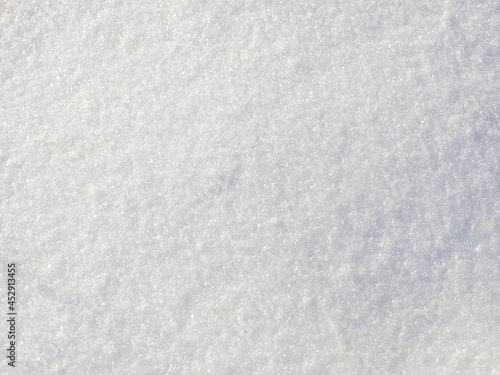 White snowy background of freshly fallen snow flakes