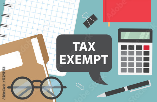 tax exempt written in speech bubble on office desk - vector illustration photo