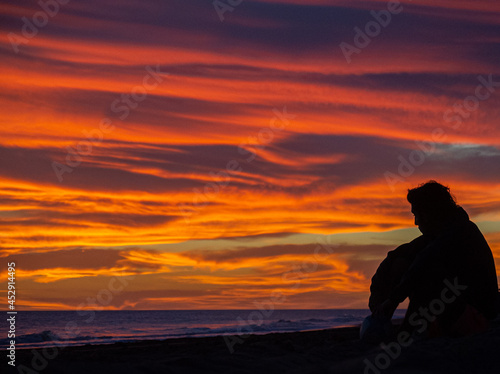 silhouette of a person on a sunset