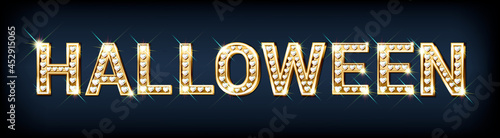 Festive banner with the word HALLOWEEN made of gold letters with diamonds