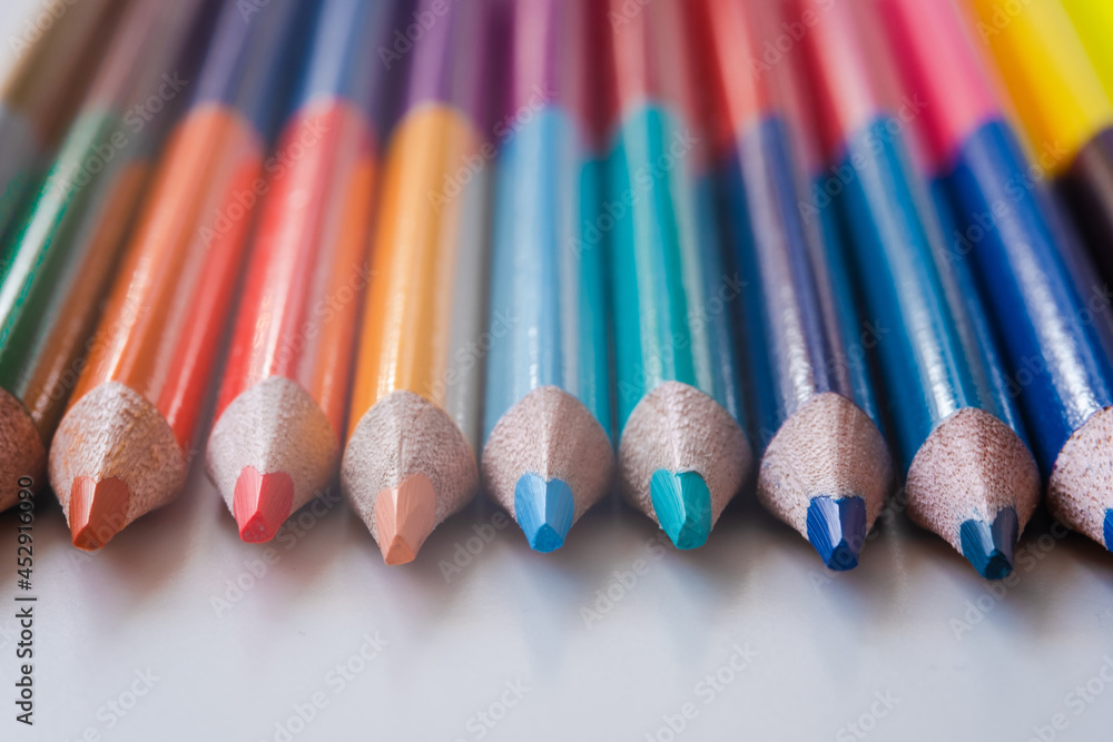 colored pencils on a white background, close-up