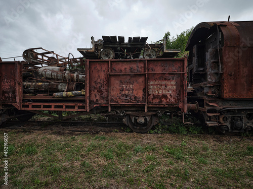 Side View of an Abandoned Rusty Steam Locomotive in a Railway Yard