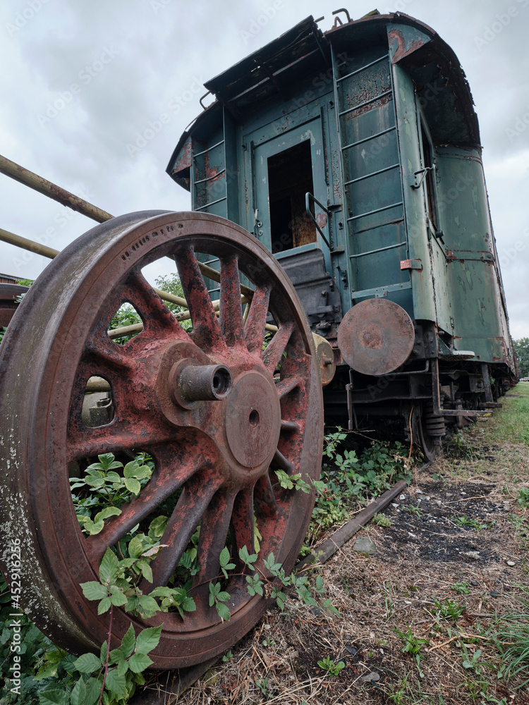Old historic train depot rusty wheel and wagon