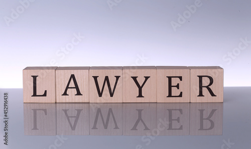 LAWYER concept, wooden word block on the grey background