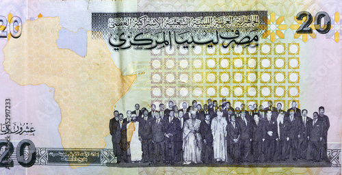 Reverse side of 20 twenty Libyan dinars banknote currency issued 2009 by the central bank of Libya Map of Libya with Muammar al-Ghaddafi with OAU members 1999, vintage retro, old Libyan money banknote