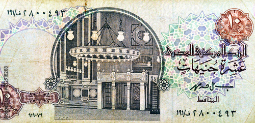 Large fragment of an old 10 ten Egyptian pounds banknote currency issued 1978 to 2000 by the central bank of Egypt with the interior of Al-Rifai mosque at center, vintage retro, old Egyptian money photo