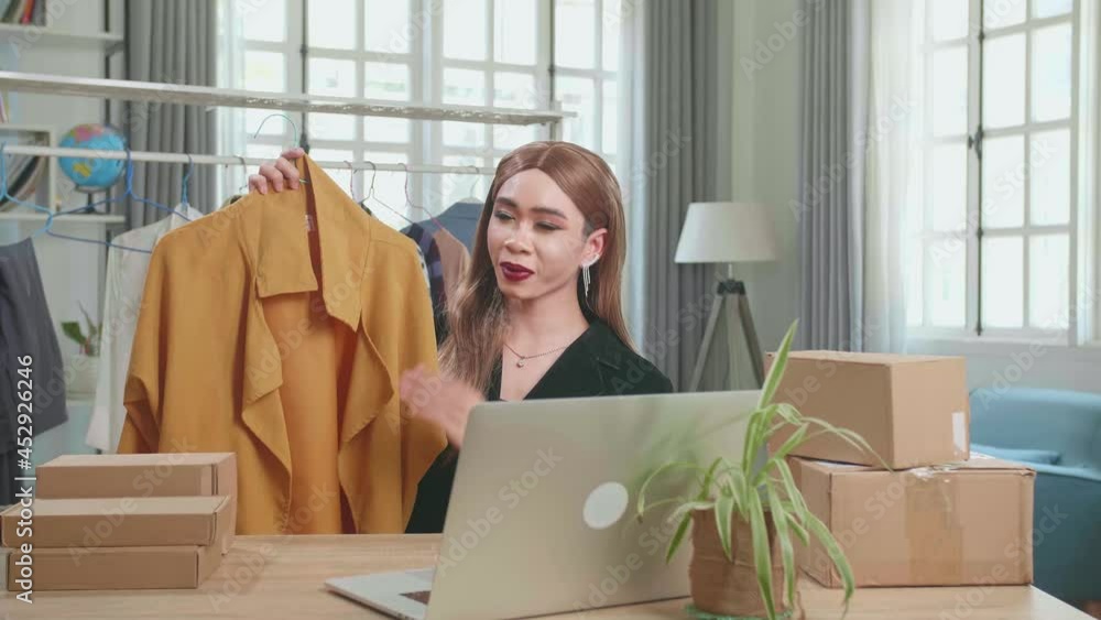 Young Asian Shemale Selling Clothes Online By Live Streaming. Selling It Online Live Streaming Concept Stock ビデオ | Adobe Stock