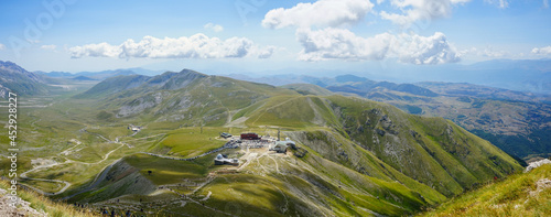 Fotografia, Obraz Campo Imperatore valley and observatory view on a summer hiking day in Gran Sass
