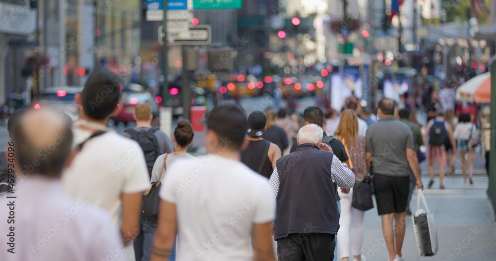 Crowd of people walking street in New York City