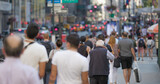 Crowd of people walking street in New York City
