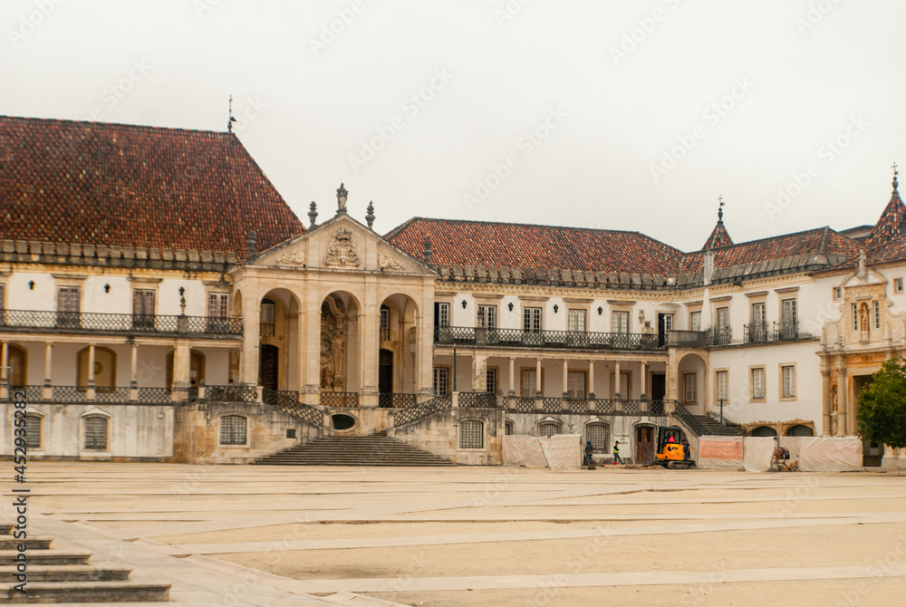 University of Coimbra Faculty of Law at the empty Paco das Escolas Square on a cloudy day - Coimbra, Portugal