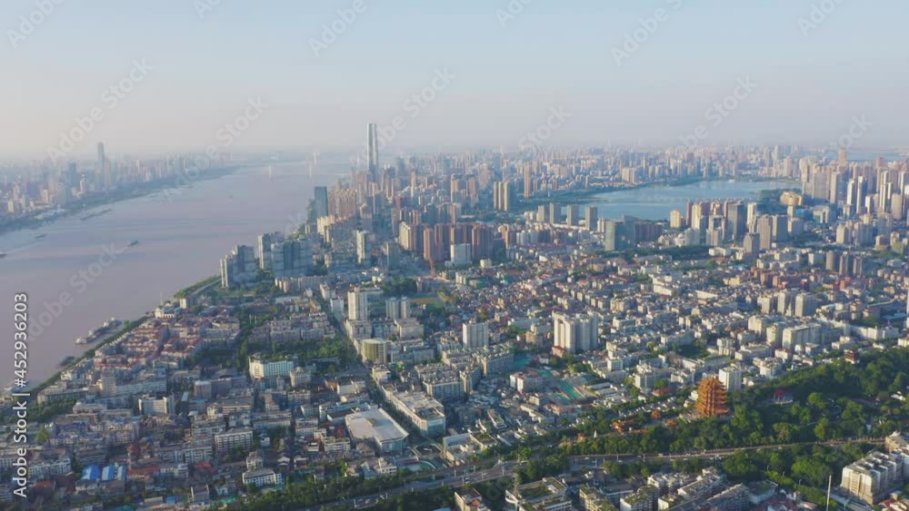 Aerial view of Wuhan skyline and Yangtze river with supertall skyscraper under construction in Wuhan Hubei China. Aerial view of Wuhan skyline and Yangtze river with supertall skyscraper under construction in Wuhan Hubei China.