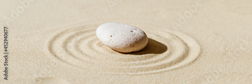 Canvas Print Zen garden meditation sandy background with stone cairn and lines on sand