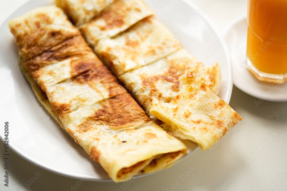 Msemen Moroccan pancakes with honey, served with orange juice and coffee